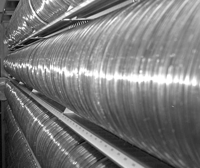 Long racks holding hundreds of reels of magnetic tape in a computer centre’s tape library.